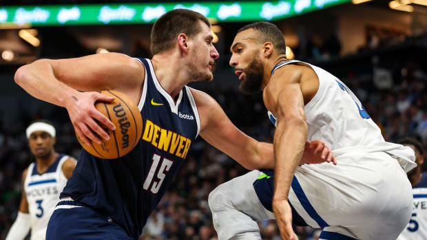 Nov 1, 2023; Minneapolis, Minnesota, USA; Denver Nuggets center Nikola Jokic (15) drives while Minnesota Timberwolves center Rudy Gobert (27) defends during the first half at Target Center.